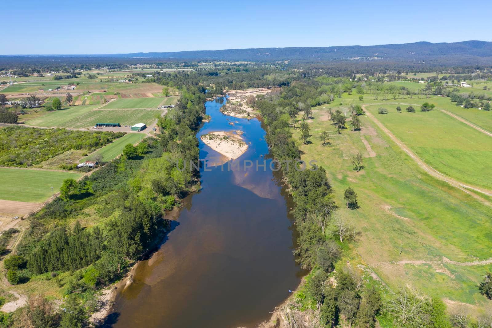 Aerial view of the Hawkesbury River and farmland in regional New South Wales in Australia by WittkePhotos