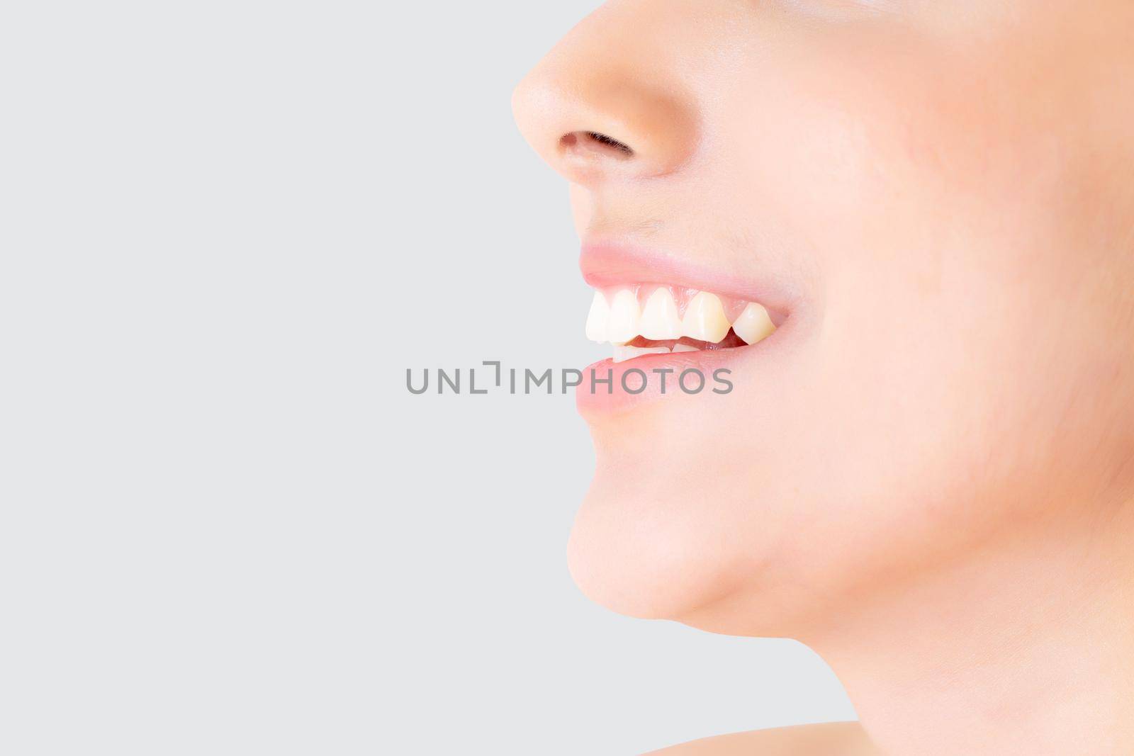 Beautiful closeup teeth of young woman isolated on white background, tooth and smile with fresh, dental and whitening, healthy and wellness, dentist and hygiene, expression with happy, mouth and lips.