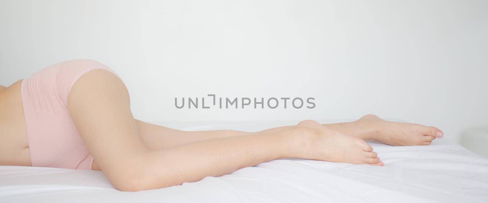 Beautiful of legs young asian woman sexy in underwear with skin smooth for health, beauty of body girl in lingerie with cellulite shape slim with diet, lifestyle and weight loss, banner website. by nnudoo