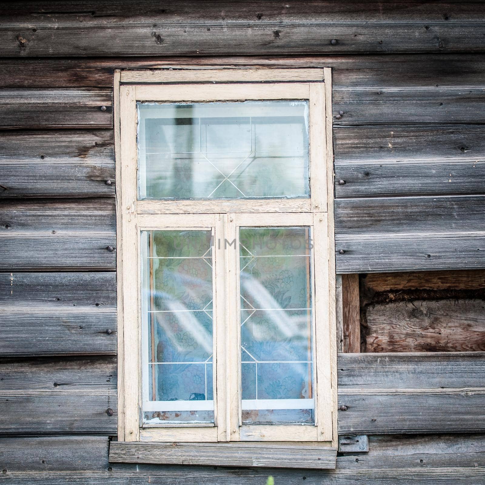 Window of old traditional russian wooden house. Kostroma, golden ring, Russia.