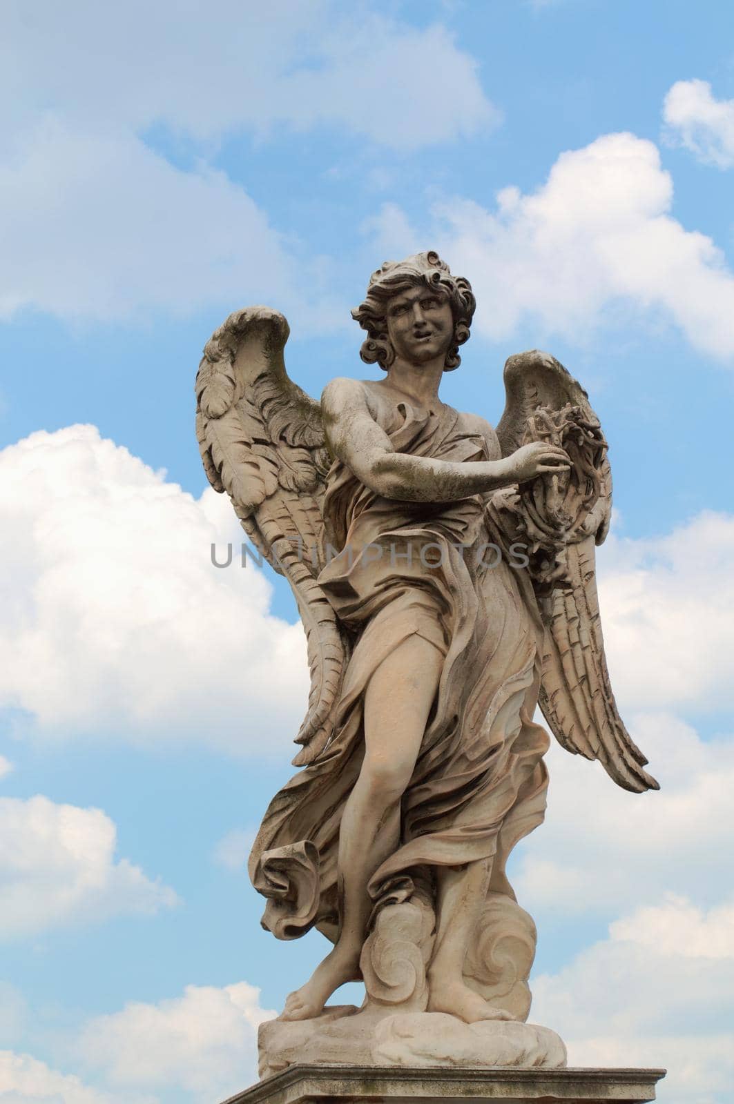 Statue of an angel against blue sky. by hernan_hyper