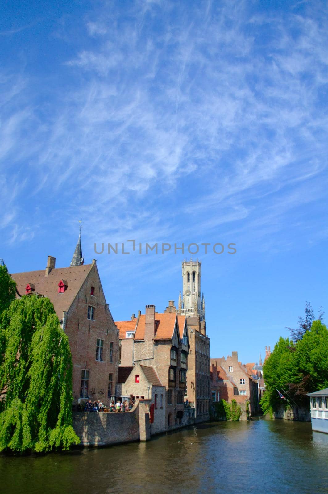 Belfry of Bruges seen from one of the surrounding canals. by hernan_hyper