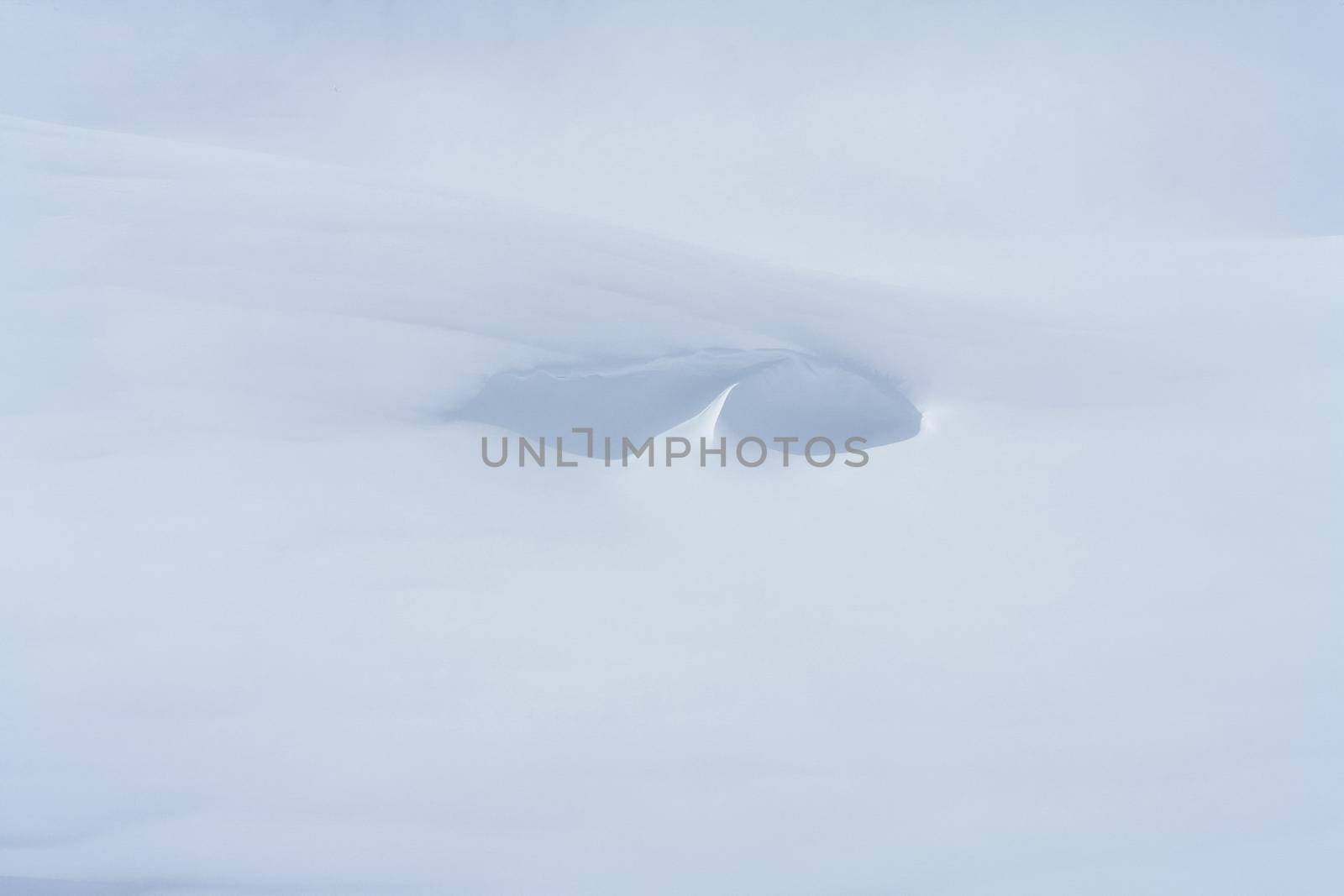 Baikal mountains in winter in snow. Forest in snow-covered mountains.