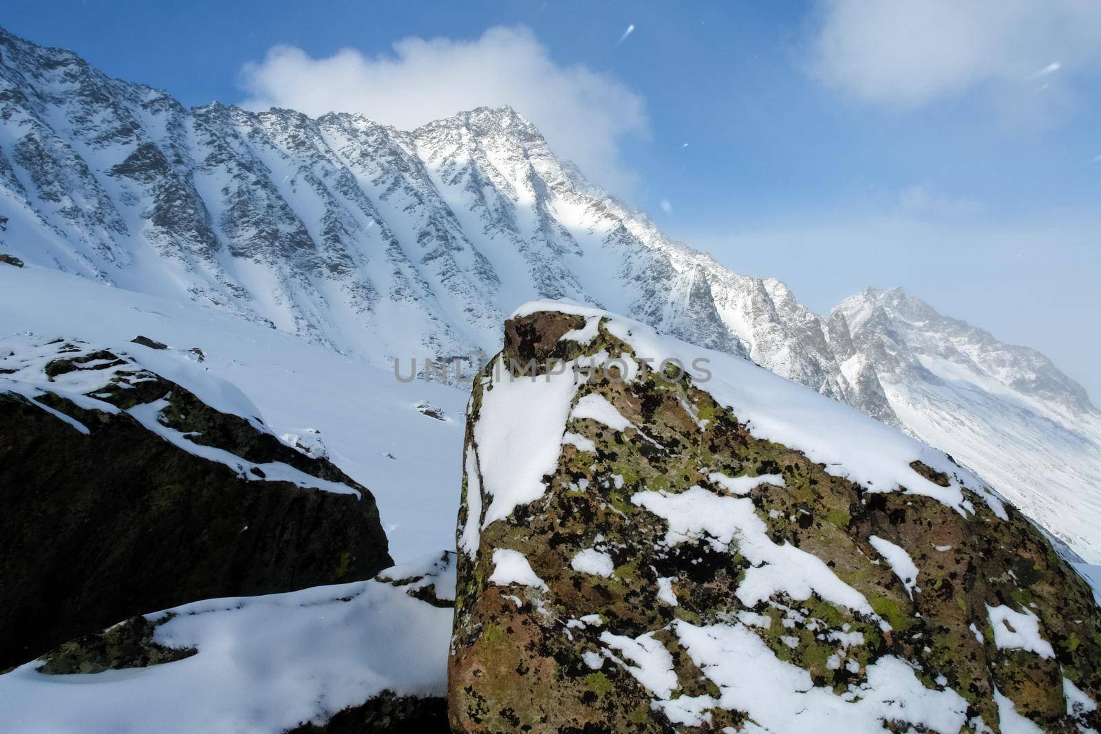 Baikal mountains in winter in snow. Forest in snow-covered mountains.