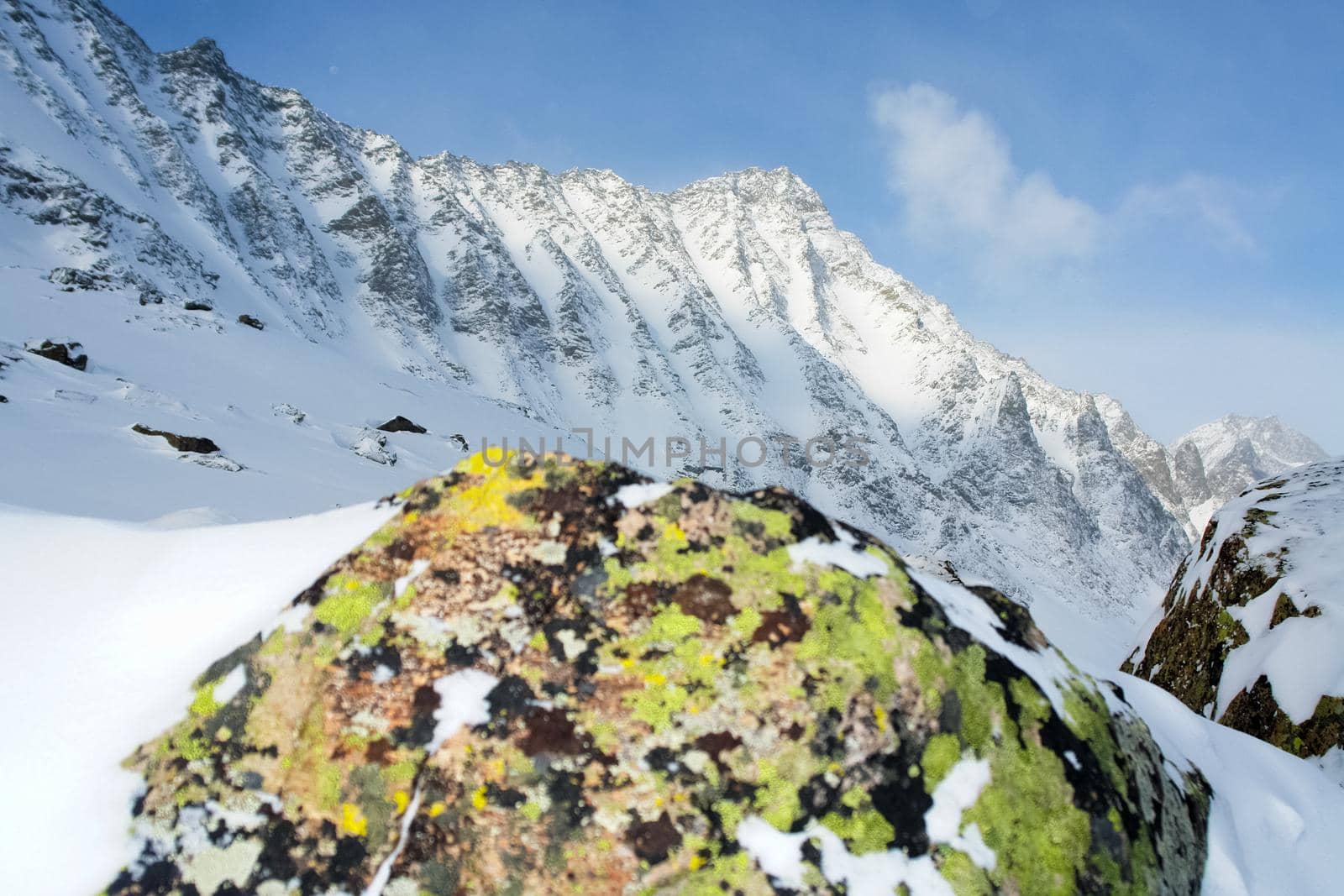 Baikal mountains in winter in snow. Forest in snow-covered mountains.