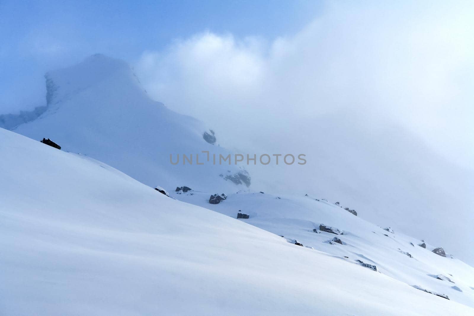 Baikal mountains in winter in snow. Forest in snow-covered mountains.