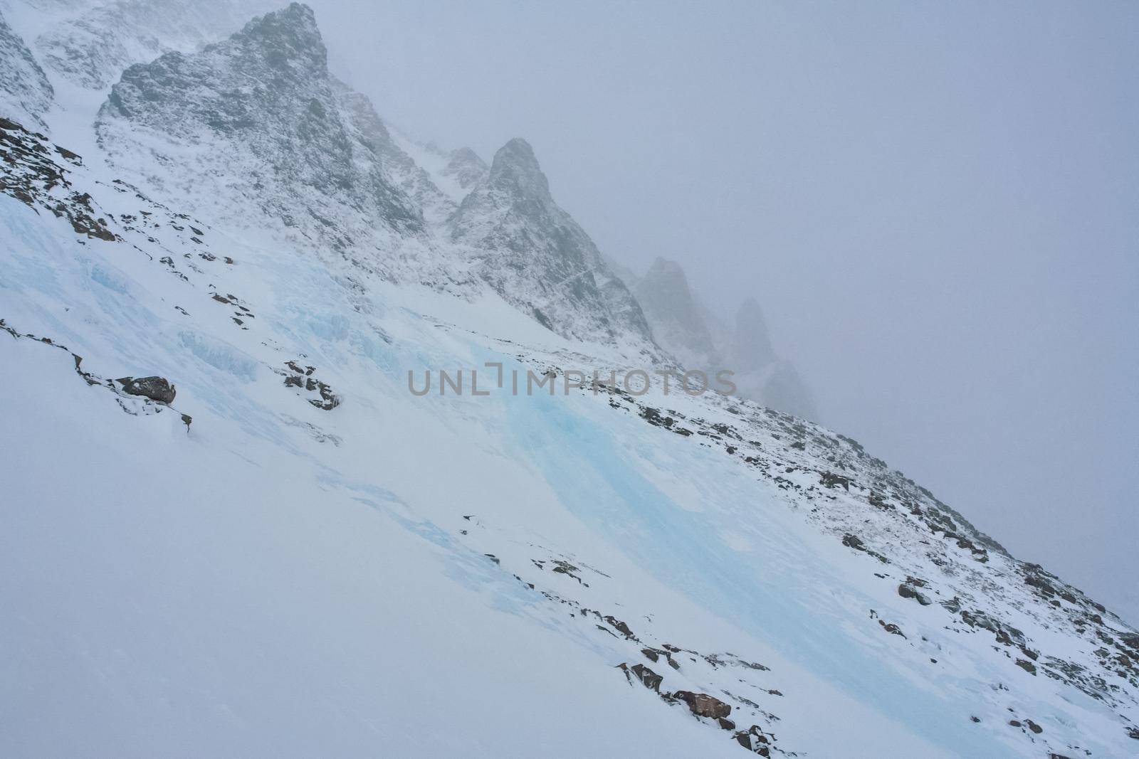 Baikal mountains in winter in snow. Forest in snow-covered mountains.