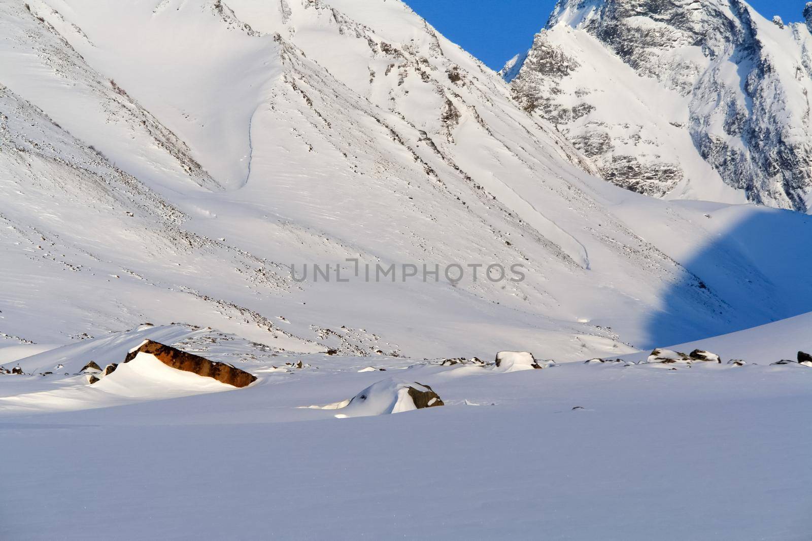 Baikal mountains in winter in snow. Forest in snow-covered mountains.