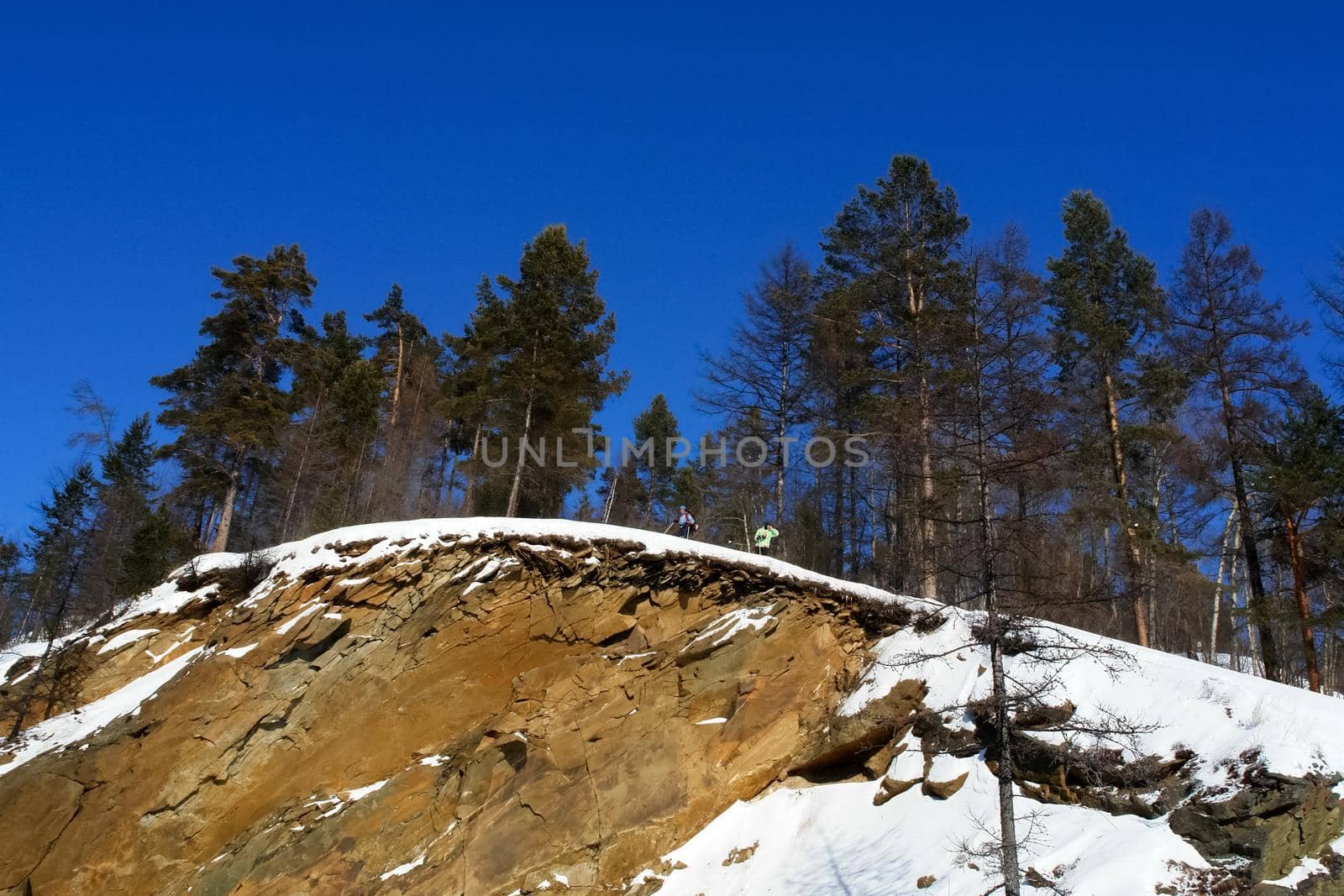 Baikal mountains in winter in snow. Forest in snow-covered mountains.