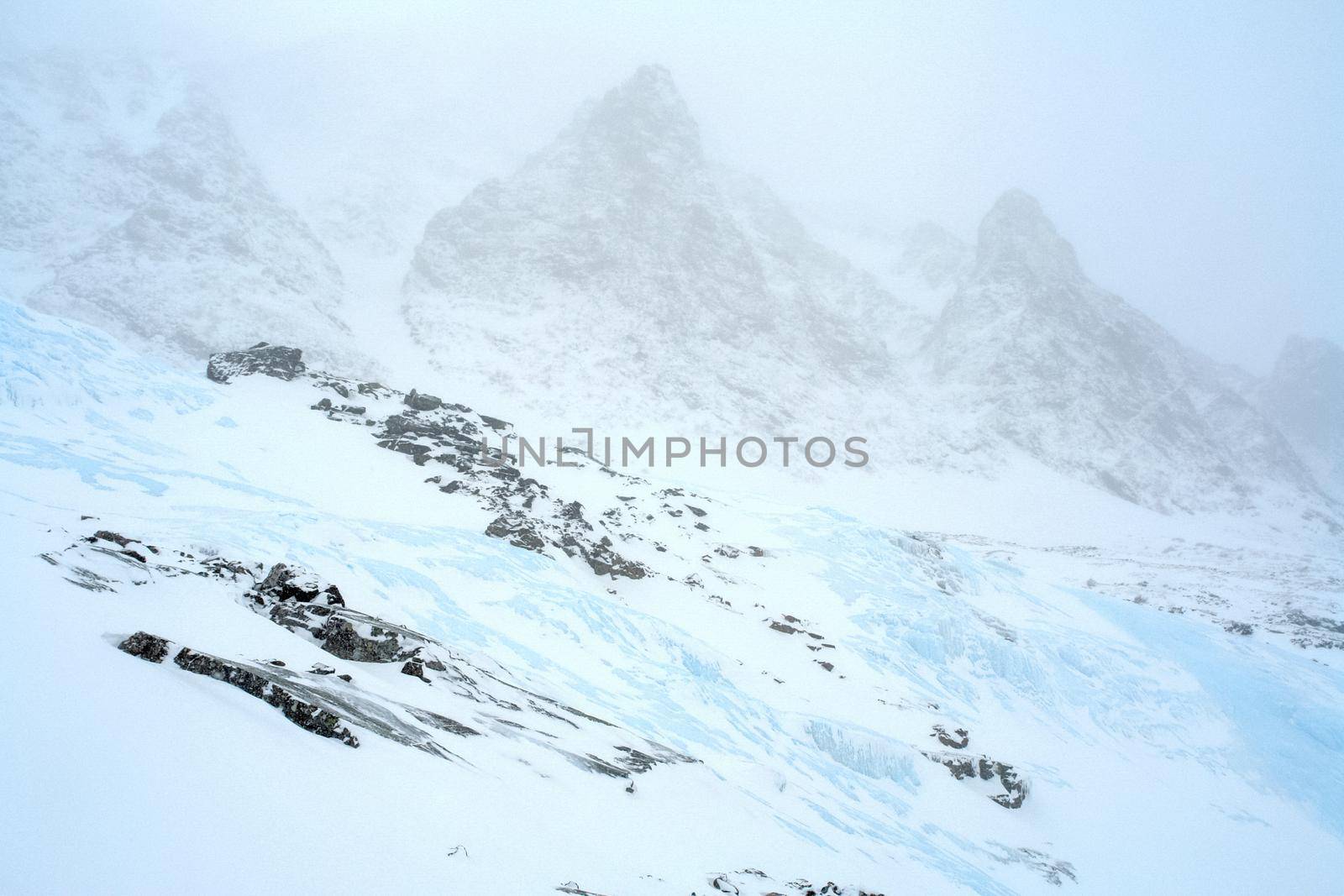 Baikal mountains in winter in snow. Forest in snow-covered mountains.