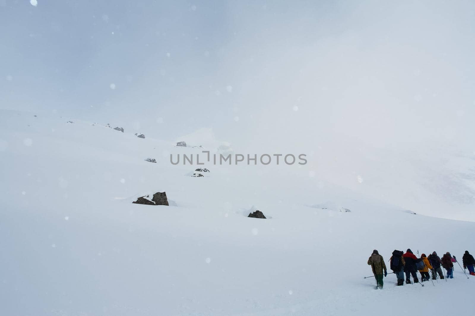 Tankhoy, Russia - January 20, 2019: A company of skiers in the mountains in the snow. Skiing.