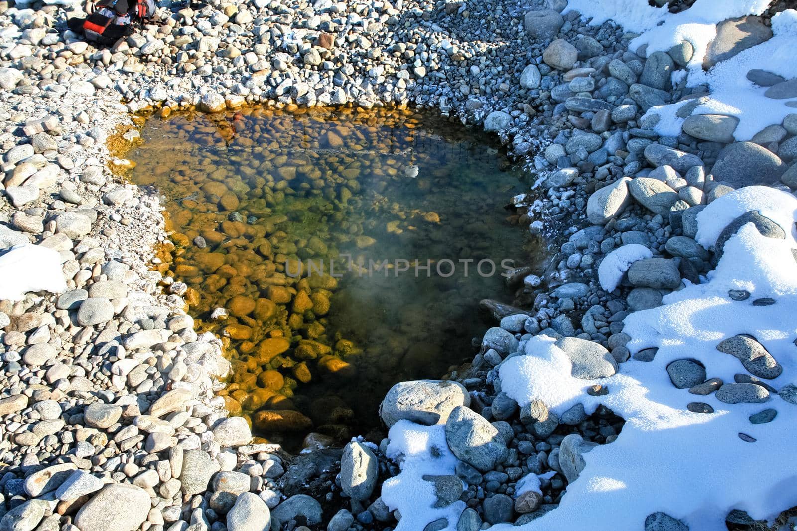 Hot puddle of water of thermal spring. by DePo