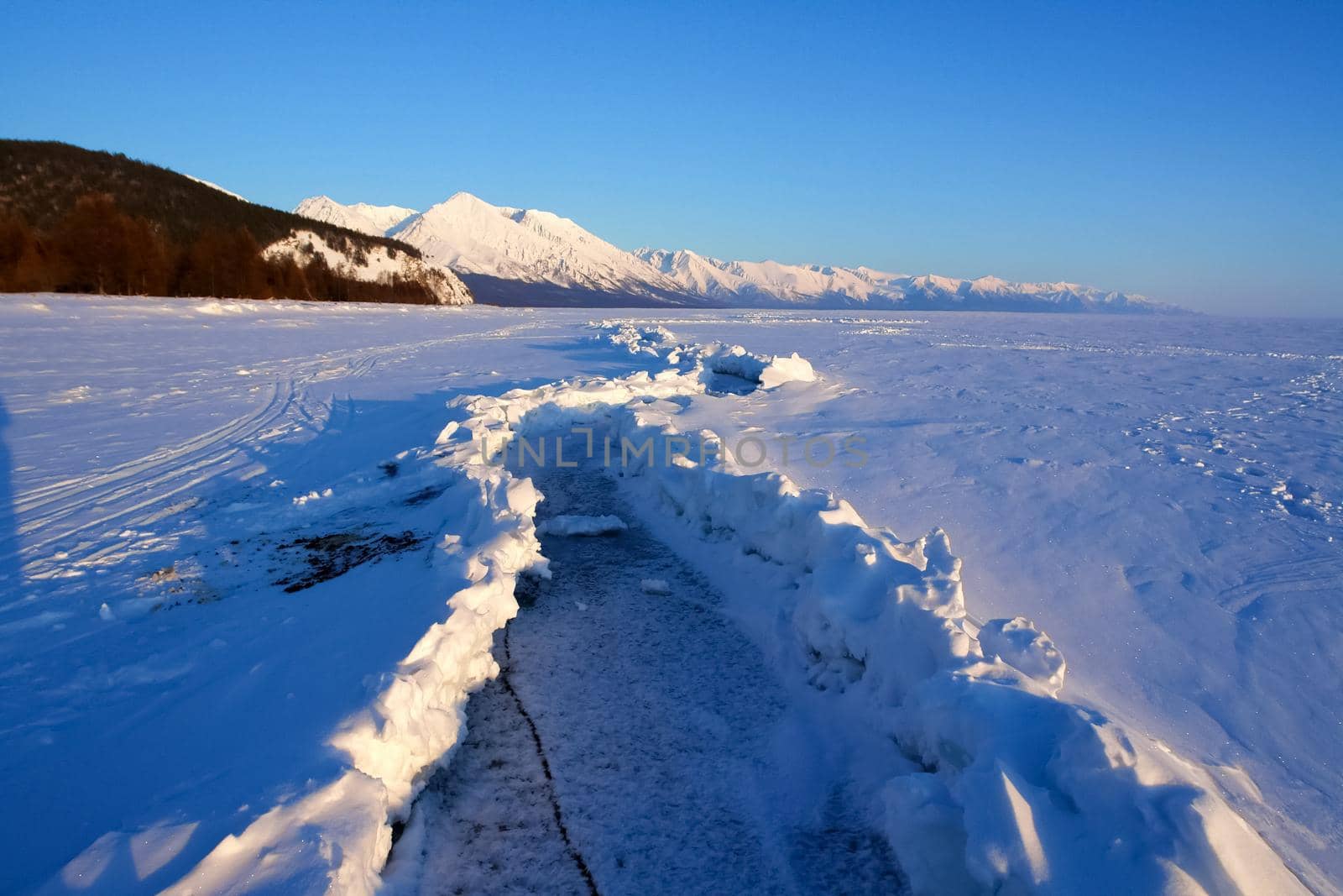 ski slope on shore of Lake Baikal. Ski track. by DePo