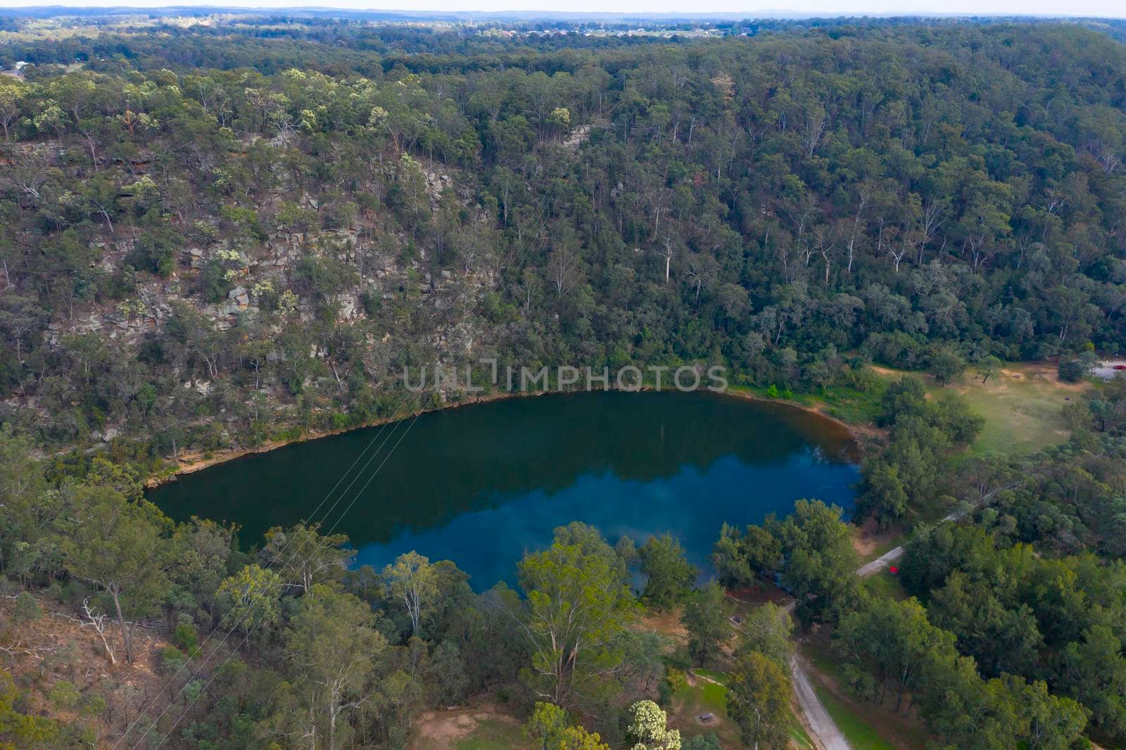A lake in a state park conservation area which is used for tourism and recreation. by WittkePhotos