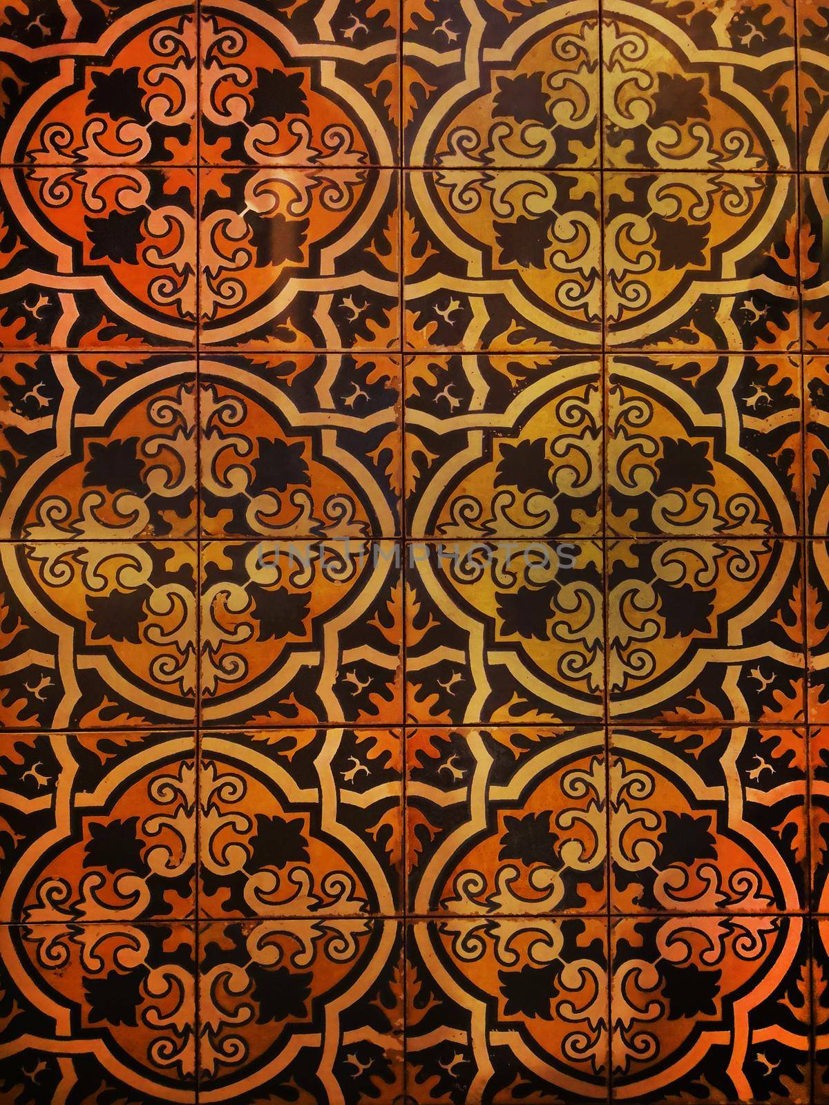 Spanish tile with beautiful figured pattern, brown, orange and black colors