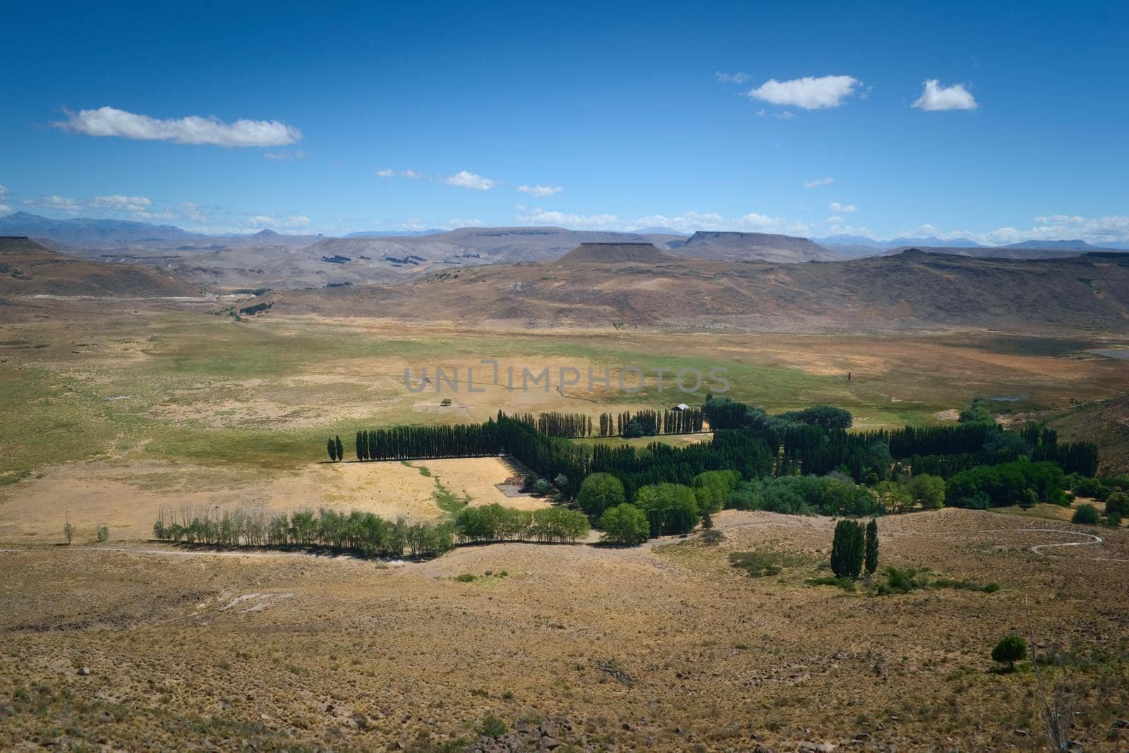 An isolated hacienda in the middle of an vast prairie