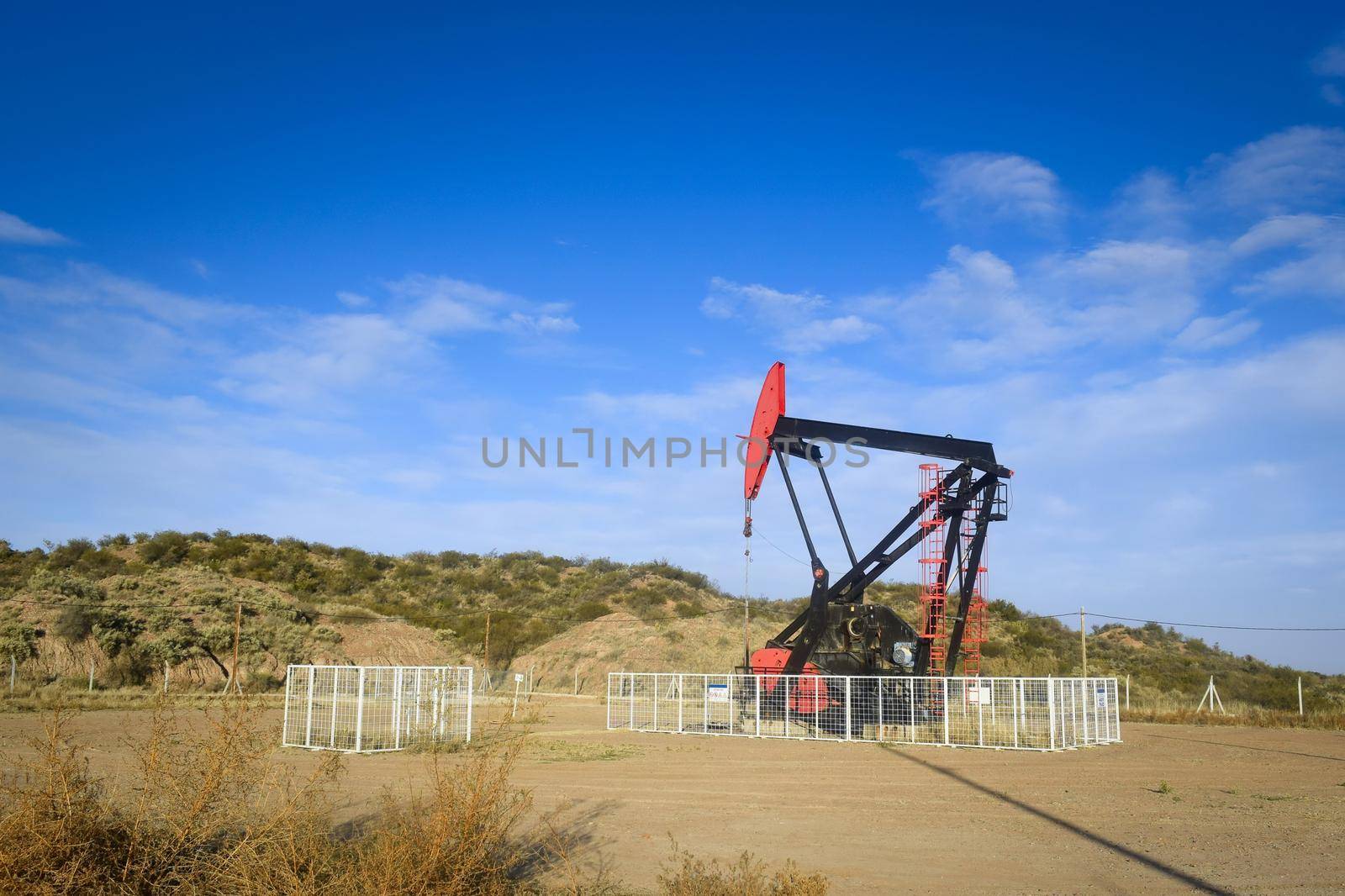 Oil extraction pumpjack in the desert of Mendoza, Argentina.