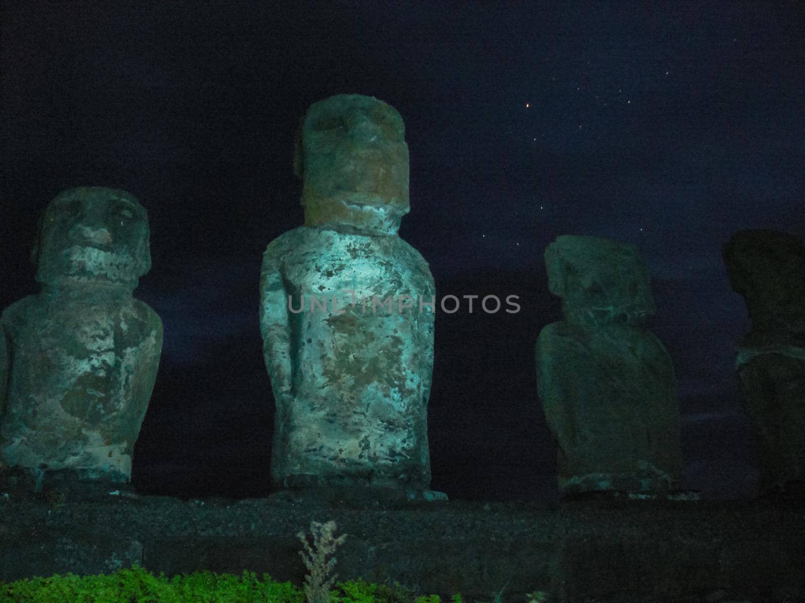 Statues Easter Island at night. Ancient statues of ancient civilization by DePo