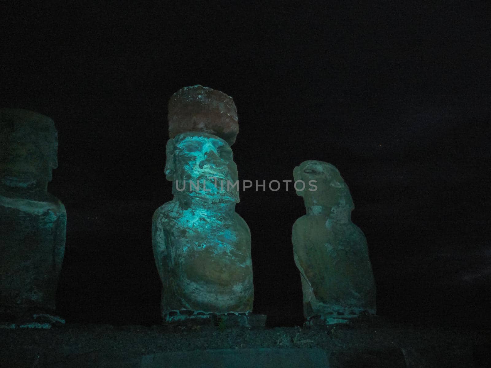 Statues Easter Island at night. Ancient statues of ancient civilization by DePo