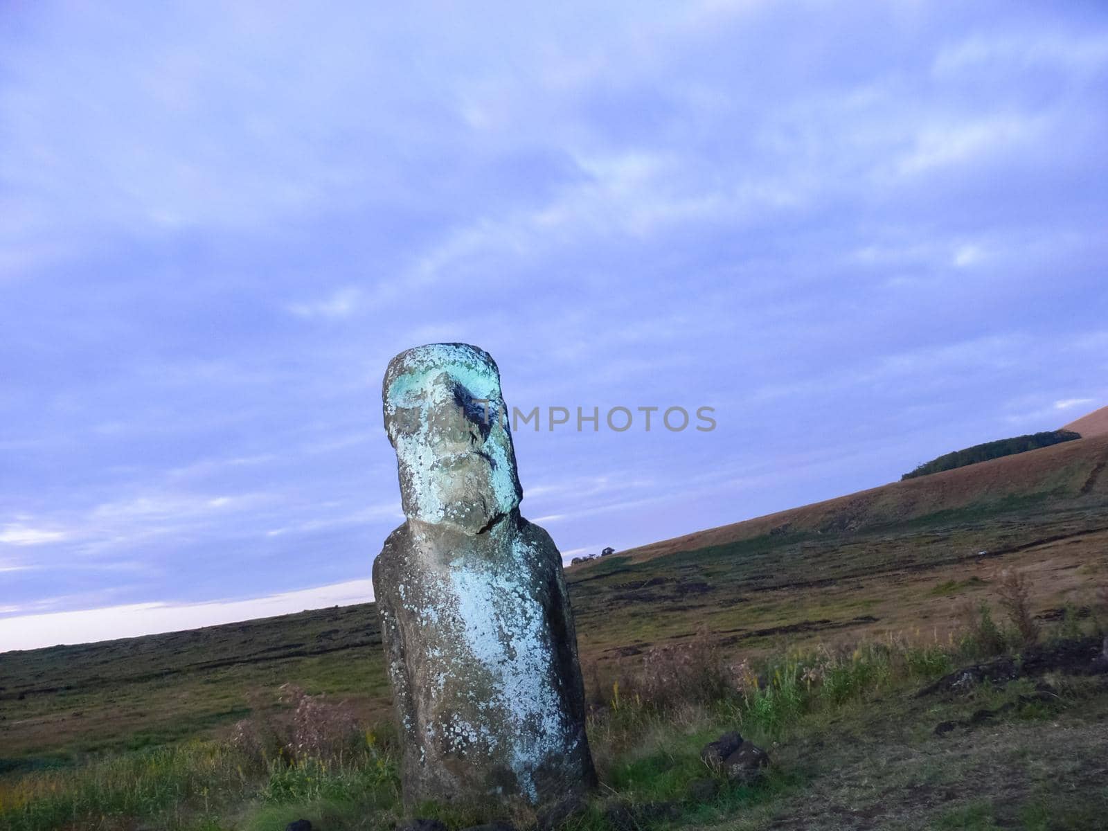 Statues of Easter Island in the background of the sunset. melting of the Easter statue in the sunlight of the sunset. by DePo