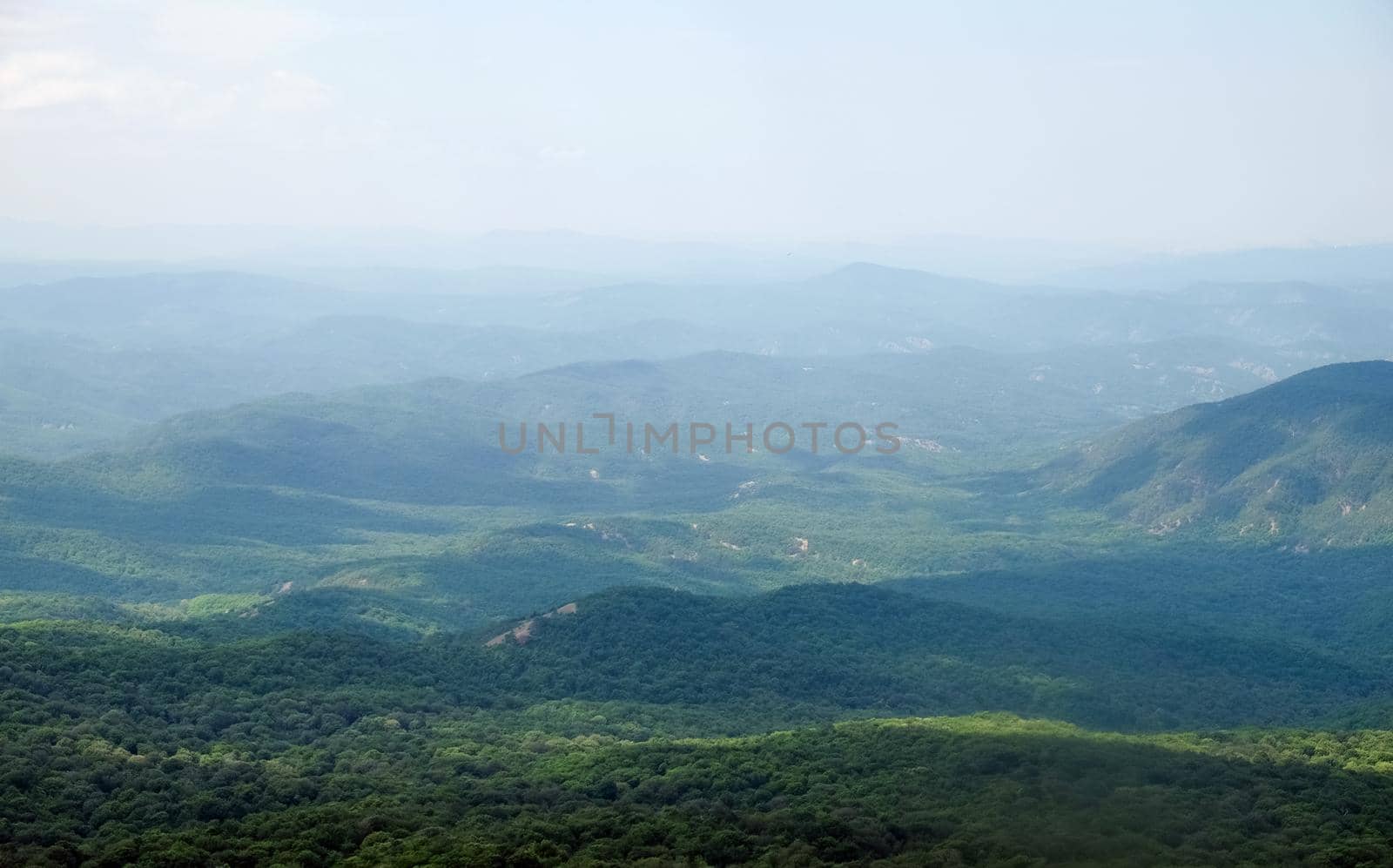 A view of the mountains covered with dense forest from the upper plateau of the Chatyr-Dag mountain range in Crimea.
