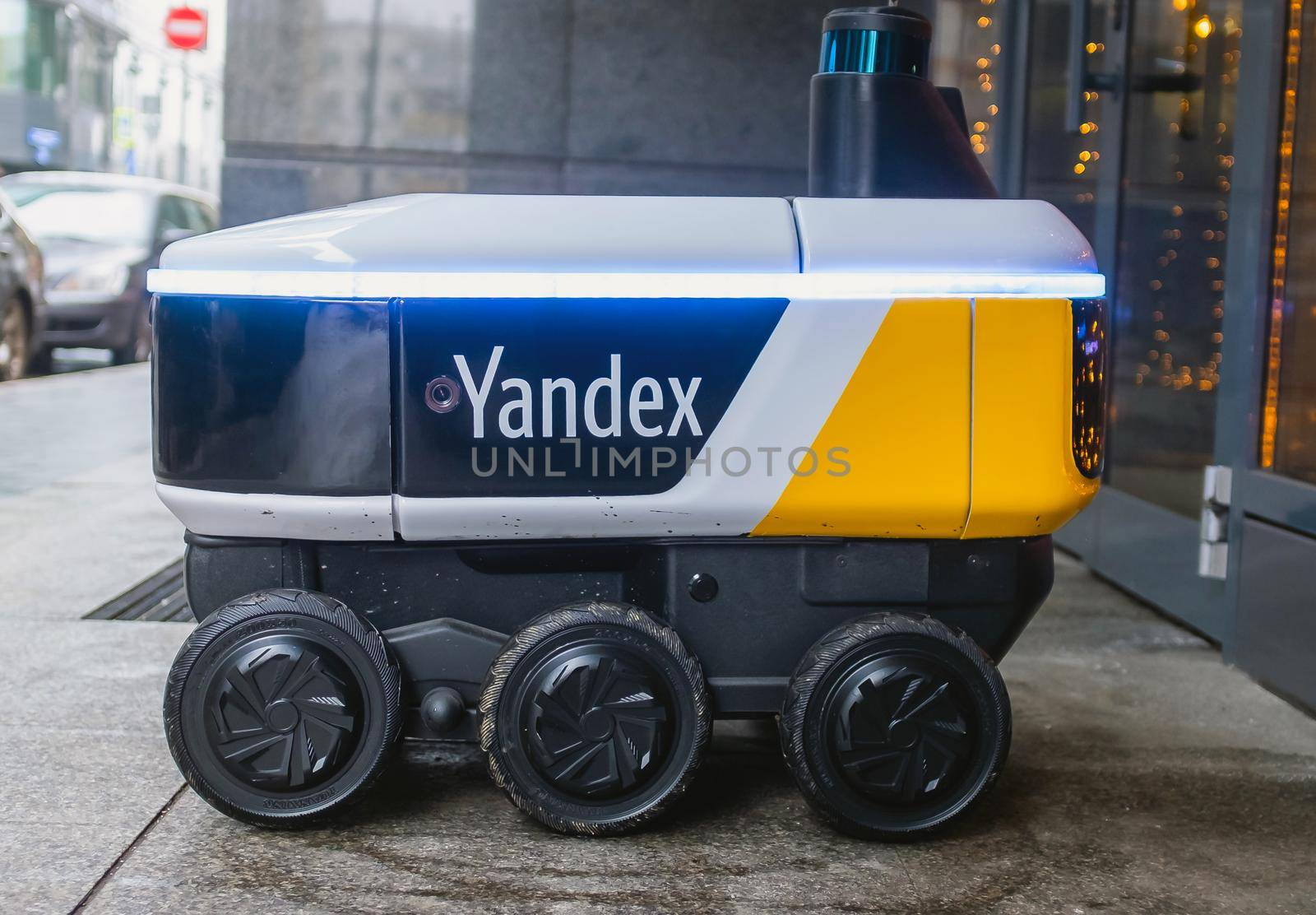 December 14, 2020, Moscow Russia. An unmanned robot courier for delivering food from the Yandex.Rover cafe at the entrance to a restaurant in Moscow.