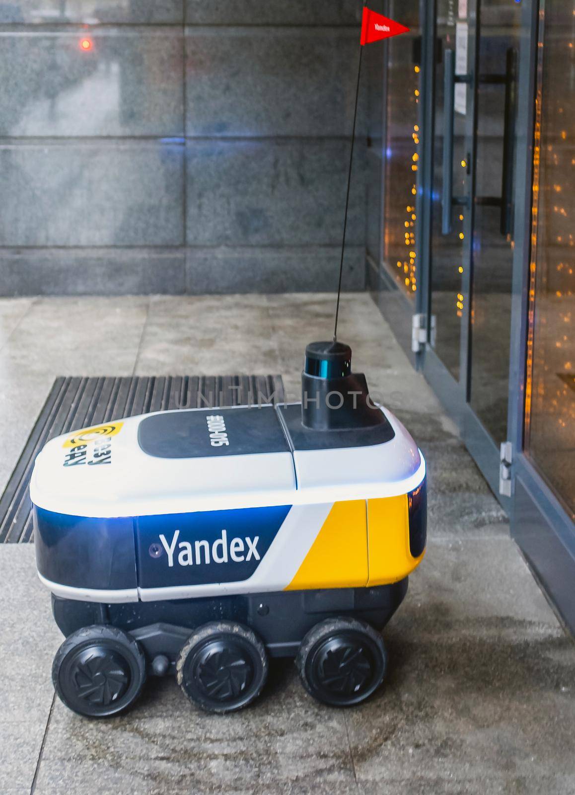 December 14, 2020, Moscow Russia. An unmanned robot courier for delivering food from the Yandex.Rover cafe at the entrance to a restaurant in Moscow.