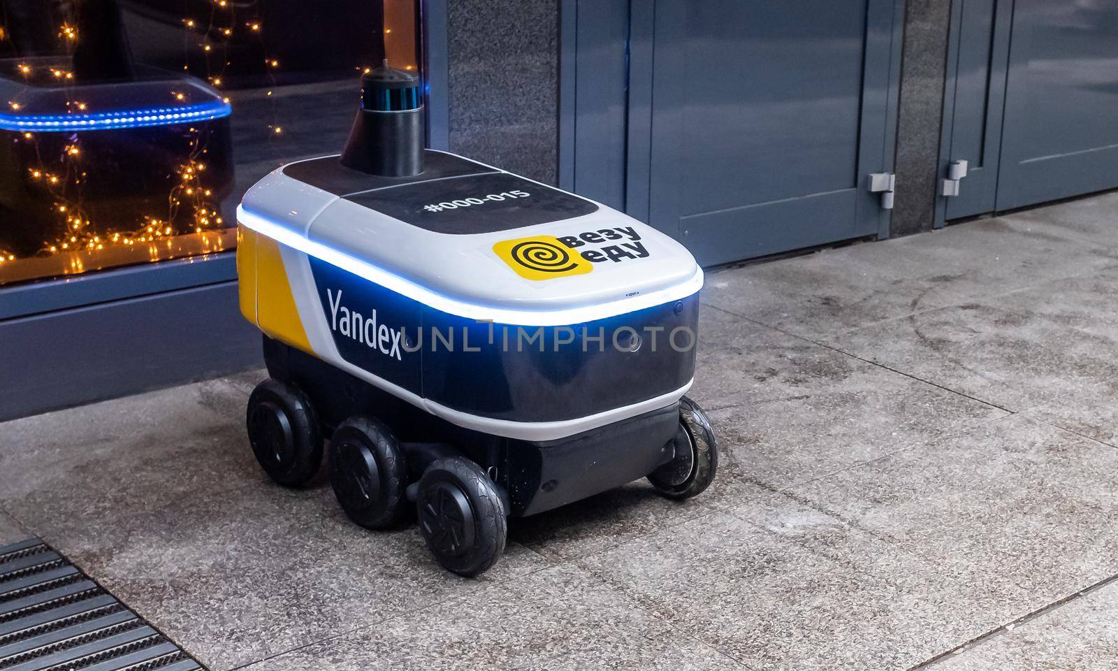 December 14, 2020, Moscow Russia. An unmanned robot courier for delivering food from the Yandex.Rover cafe at the entrance to a restaurant in Moscow.
