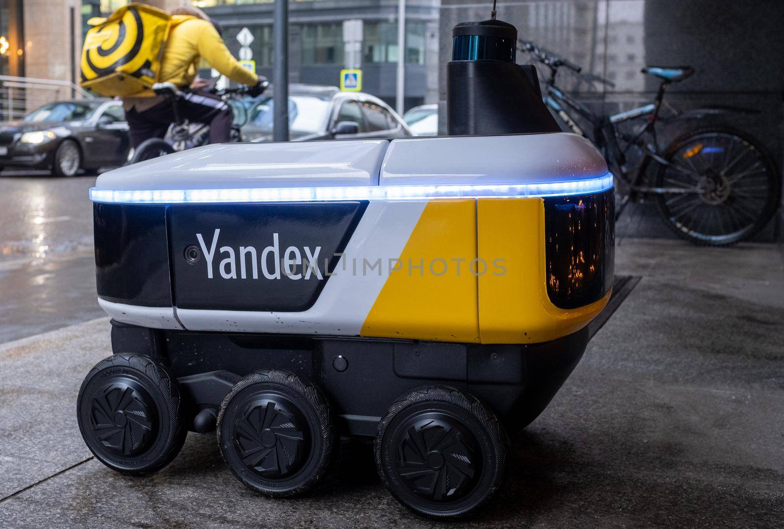 December 14, 2020, Moscow Russia. An unmanned robot courier for delivering food from the Yandex.Rover cafe at the entrance to a restaurant in Moscow.