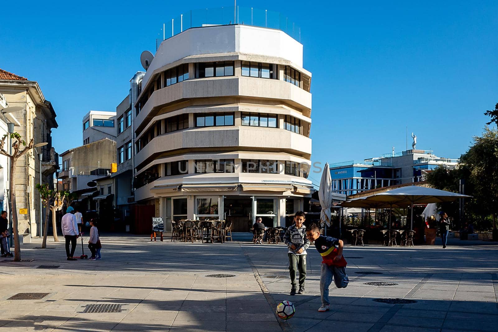 April 22, 2019, Limassol, Cyprus. Children play soccer in the city square .