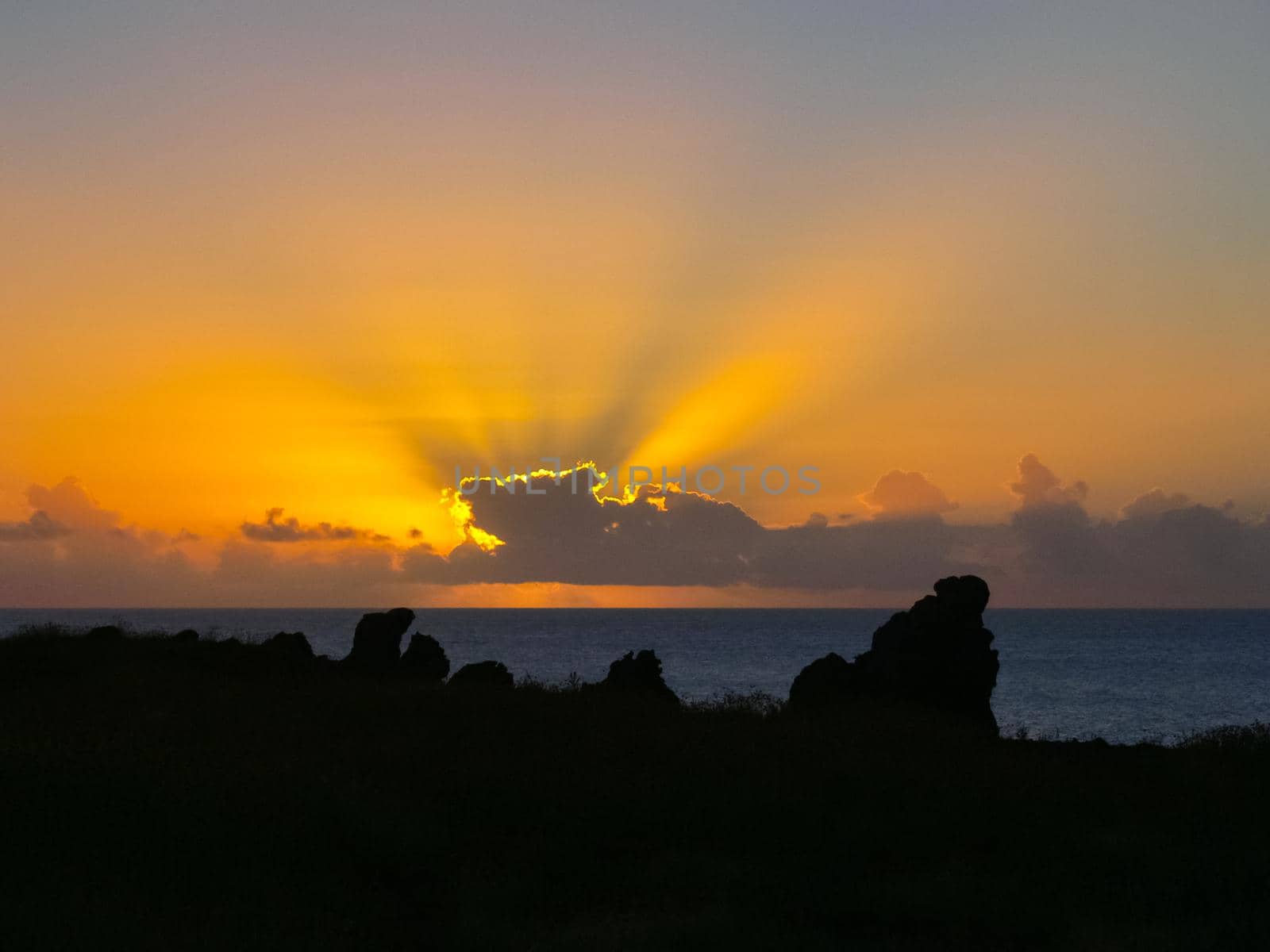 Sunset on Easter Island. The colors of sunset in ocean. by DePo