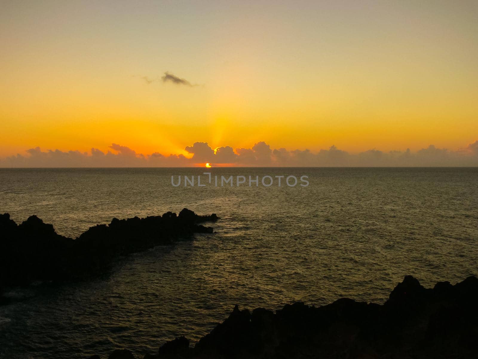 Sunset on Easter Island. The colors of sunset in ocean. by DePo