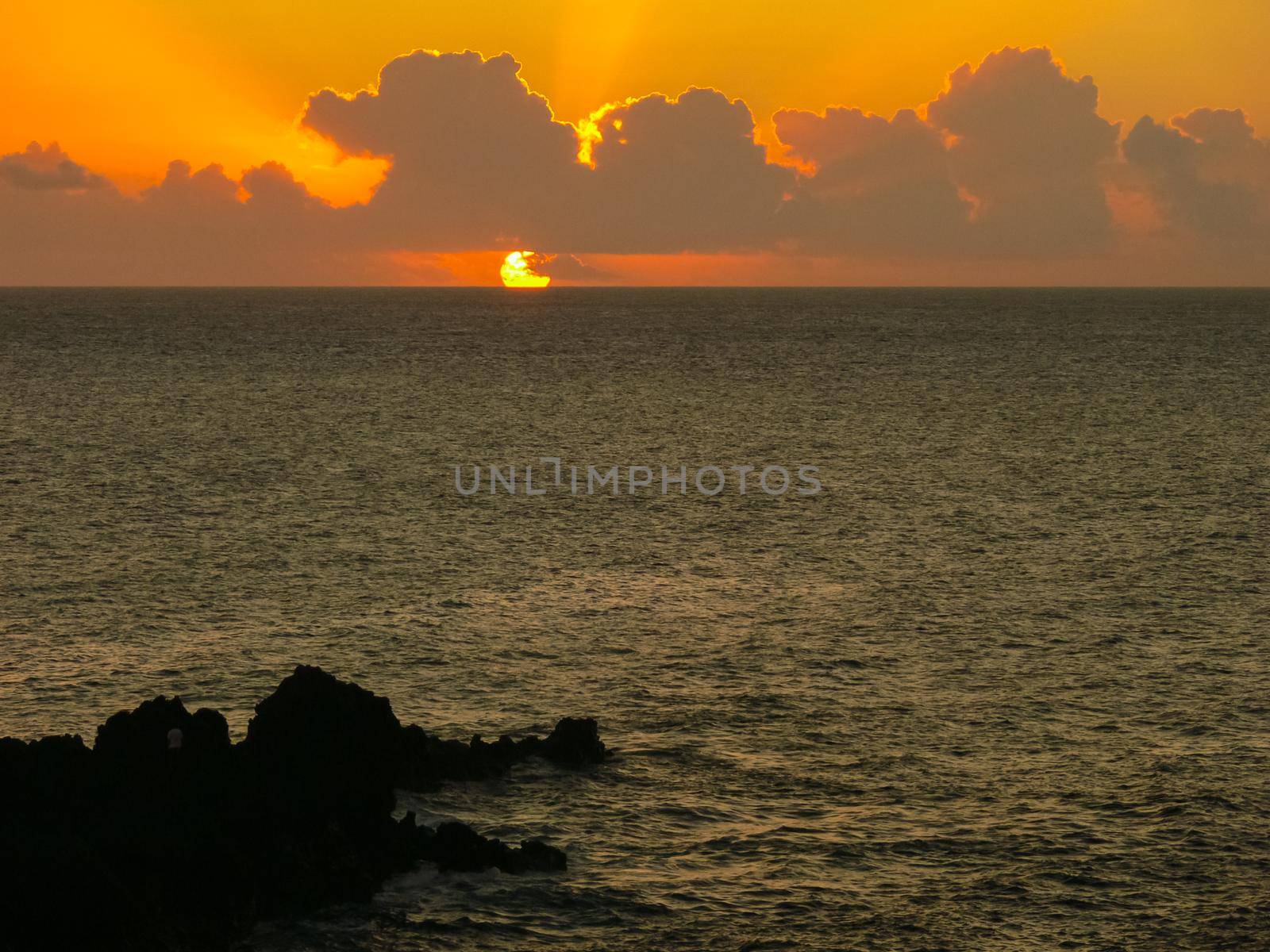 Sunset on Easter Island. The colors of sunset in ocean. by DePo