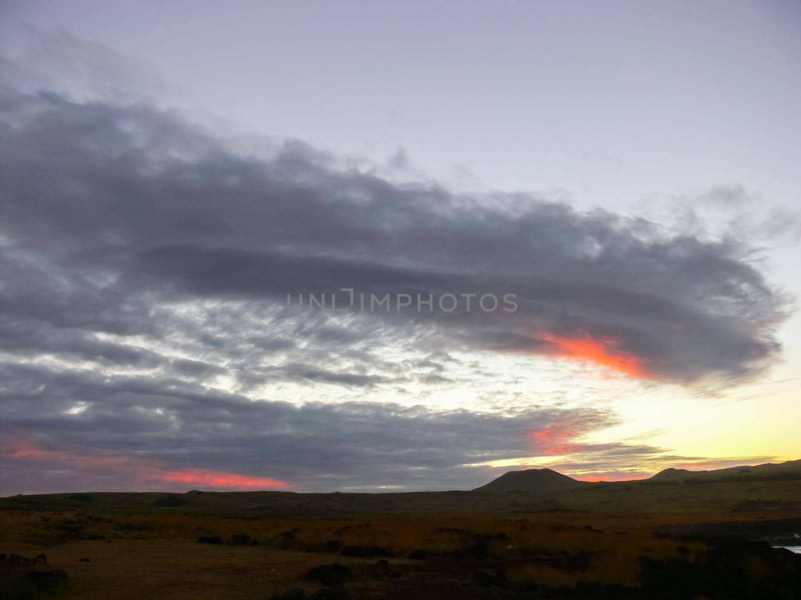 Sunset on Easter Island. The colors of sunset in ocean. by DePo