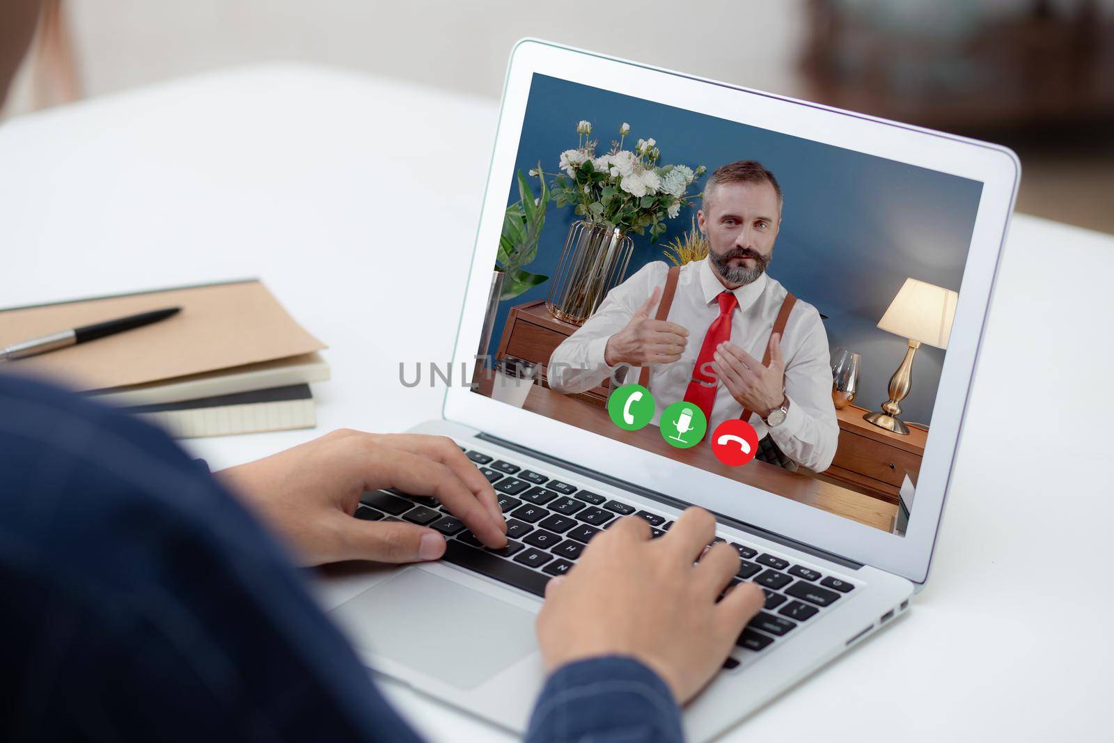 Young asian businessman video conference and discussion with businessman, man work from home with laptop computer with social distancing, meeting online, communication and business concept. by nnudoo