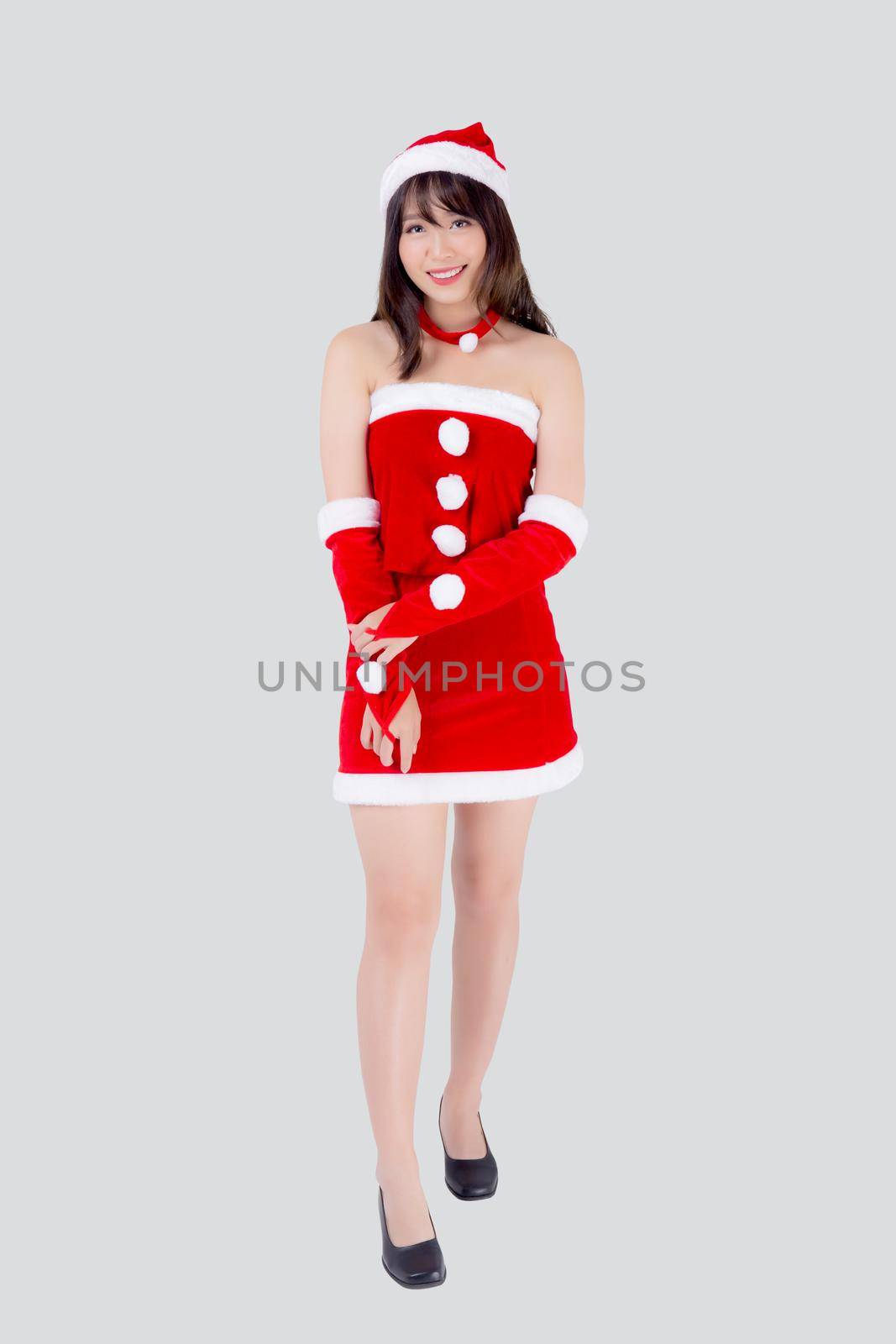 Beautiful portrait young asian woman Santa costume wear hat smiling with happy in holiday xmas, beauty model asia girl cheerful and happiness celebrating in Christmas isolated on white background. by nnudoo