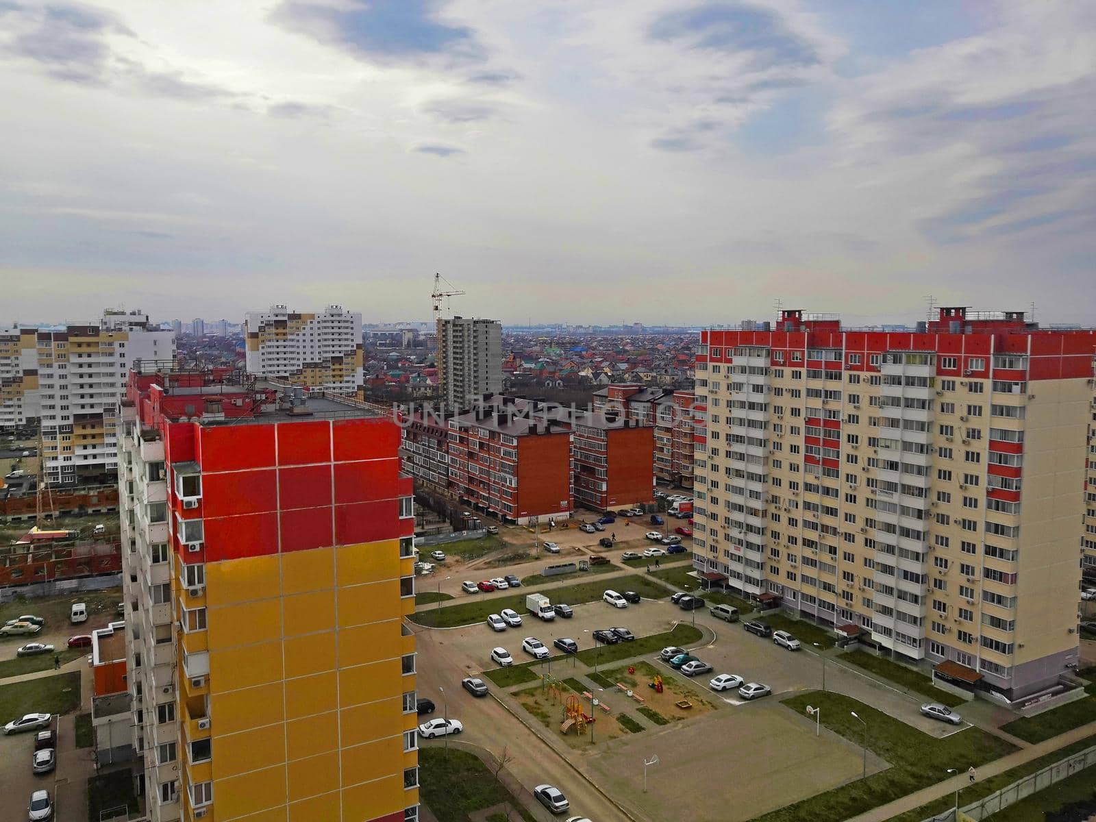 High view of residental area with multi-storey buildings and parking, autumn, Russia
