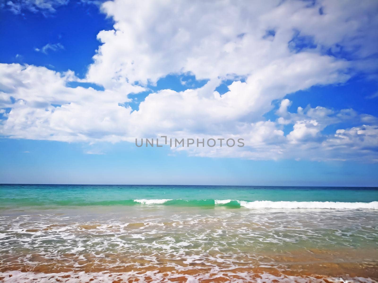 Summer beach with blue sea and waves, amazing blue sky with white clouds by Bezdnatm