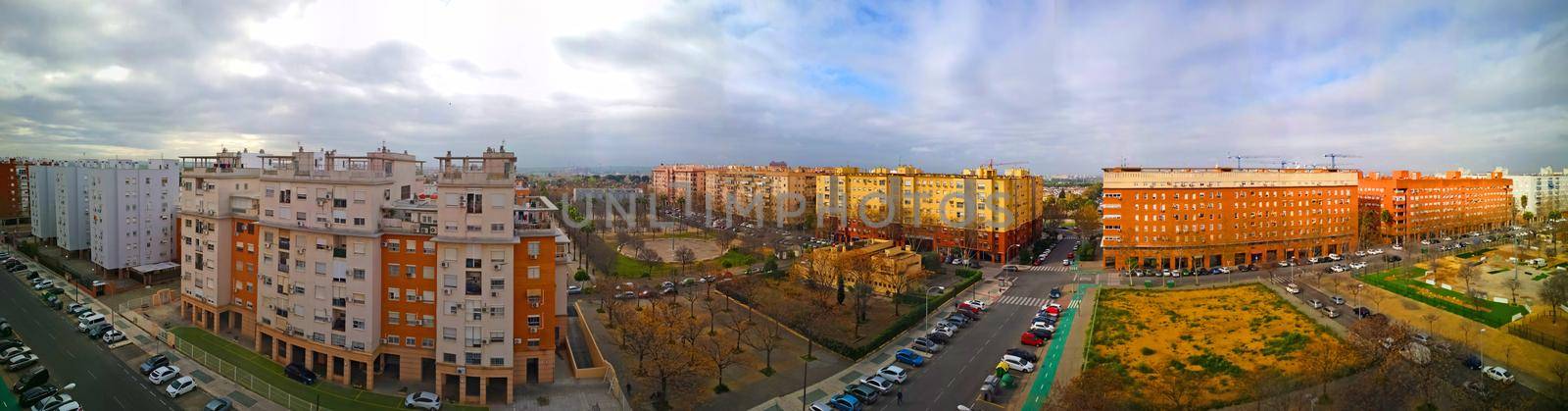 Wide panoramic view of the street with modern buildings and streets with cars, spring, Spain