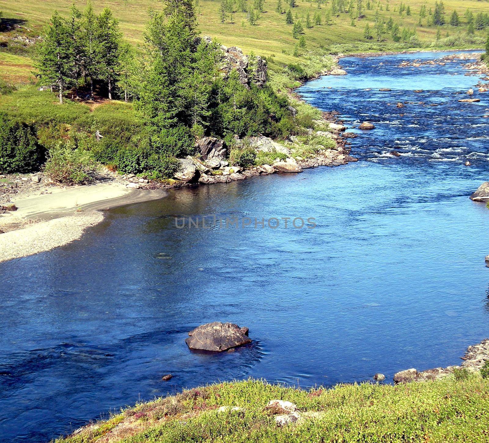 River in the taiga in northern Russia. The nature of the taiga in a mountainous area.