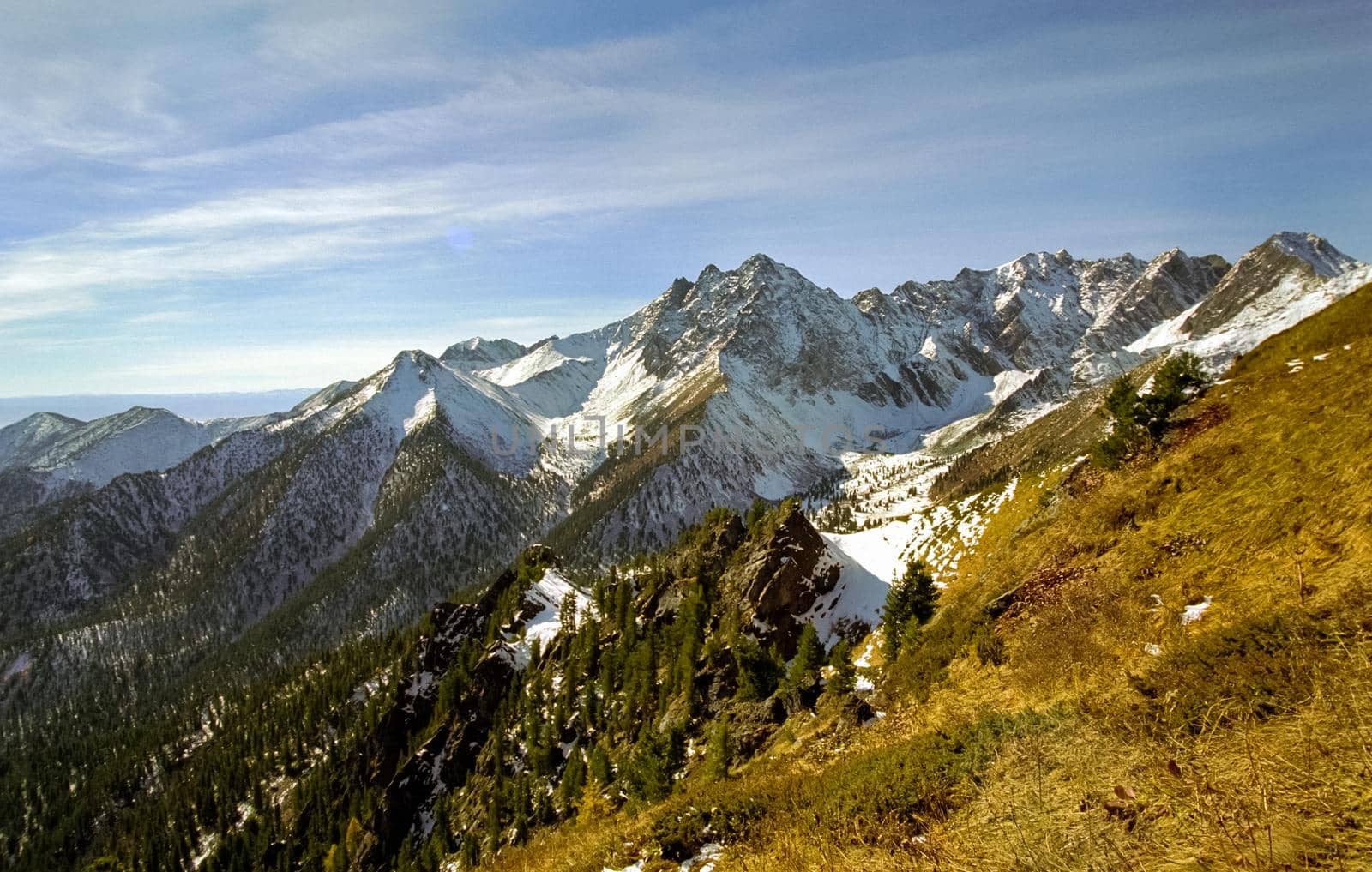 Mount Sayan in winter in the snow. The nature of the mountains is sayan.