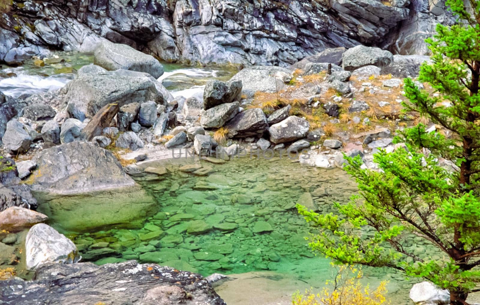 Mountain river. Stones and water of mountain river. The mountains are said. by DePo