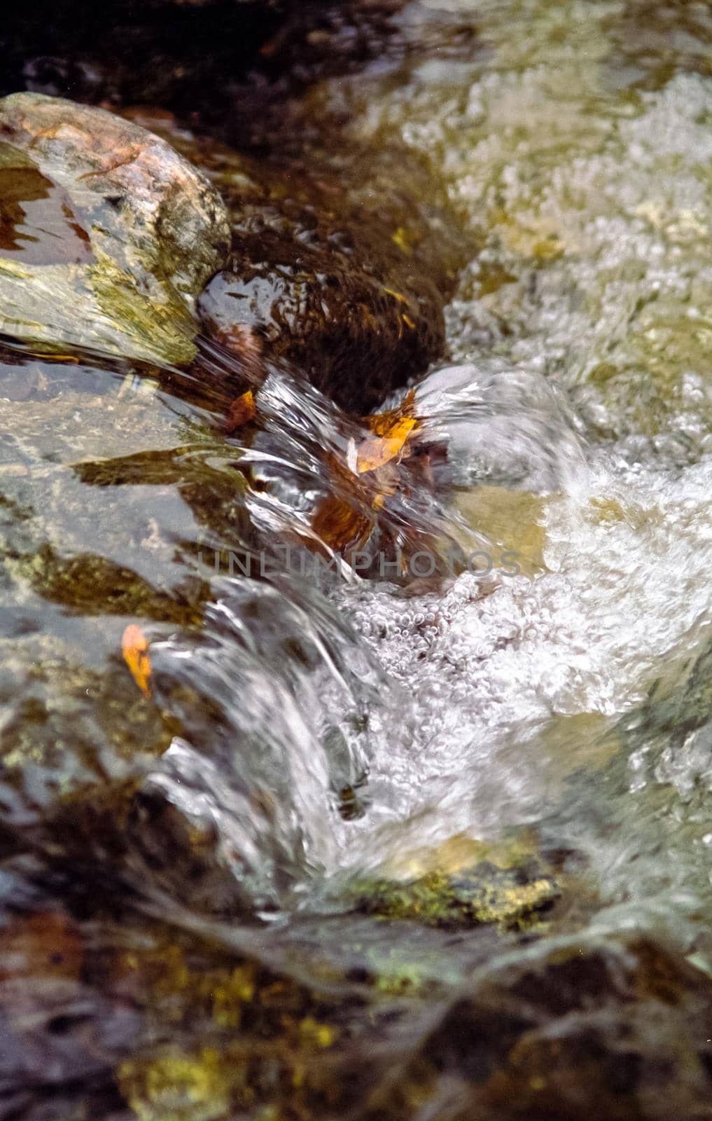 Mountain river. Stones and water of a mountain river. The mountains are said.