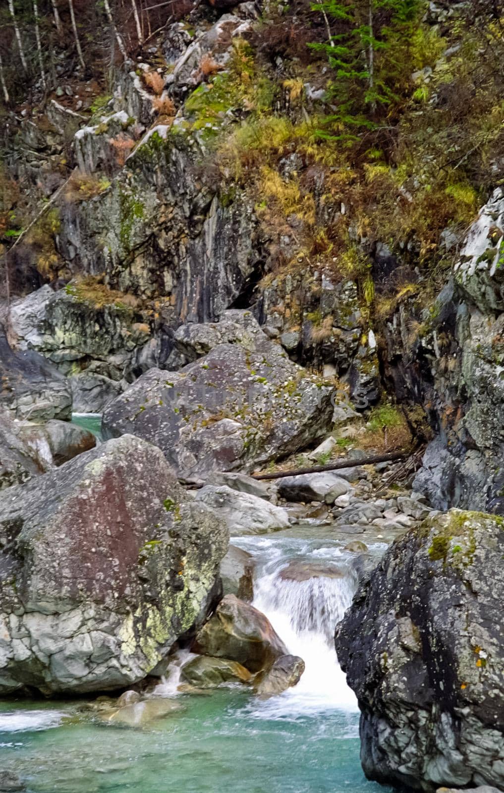 Mountain river. Stones and water of a mountain river. The mountains are said.