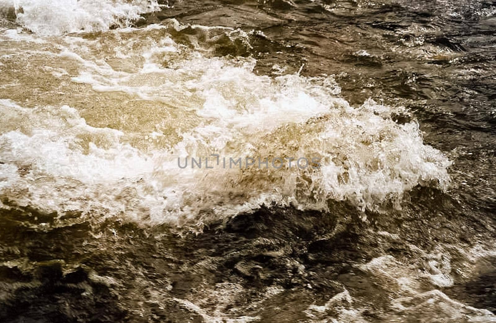 Mountain river. Stones and water of a mountain river. The mountains are said.