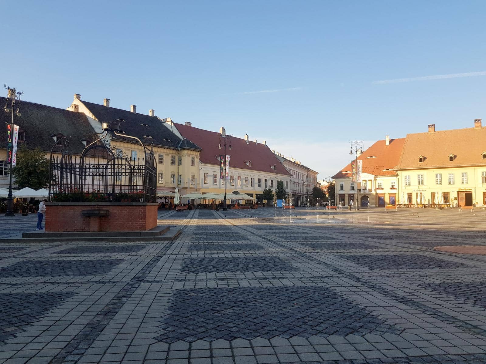 Sibiu / Romania - 18-Aug-20: Main square with houses during a sunny day