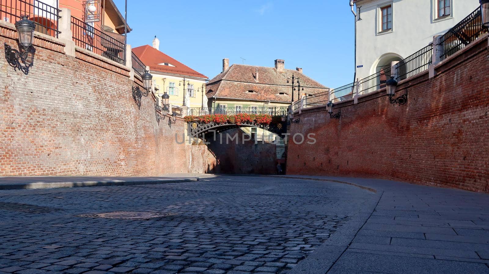 Lies bridge in Sibiu, Romania. Pavement road in shadow