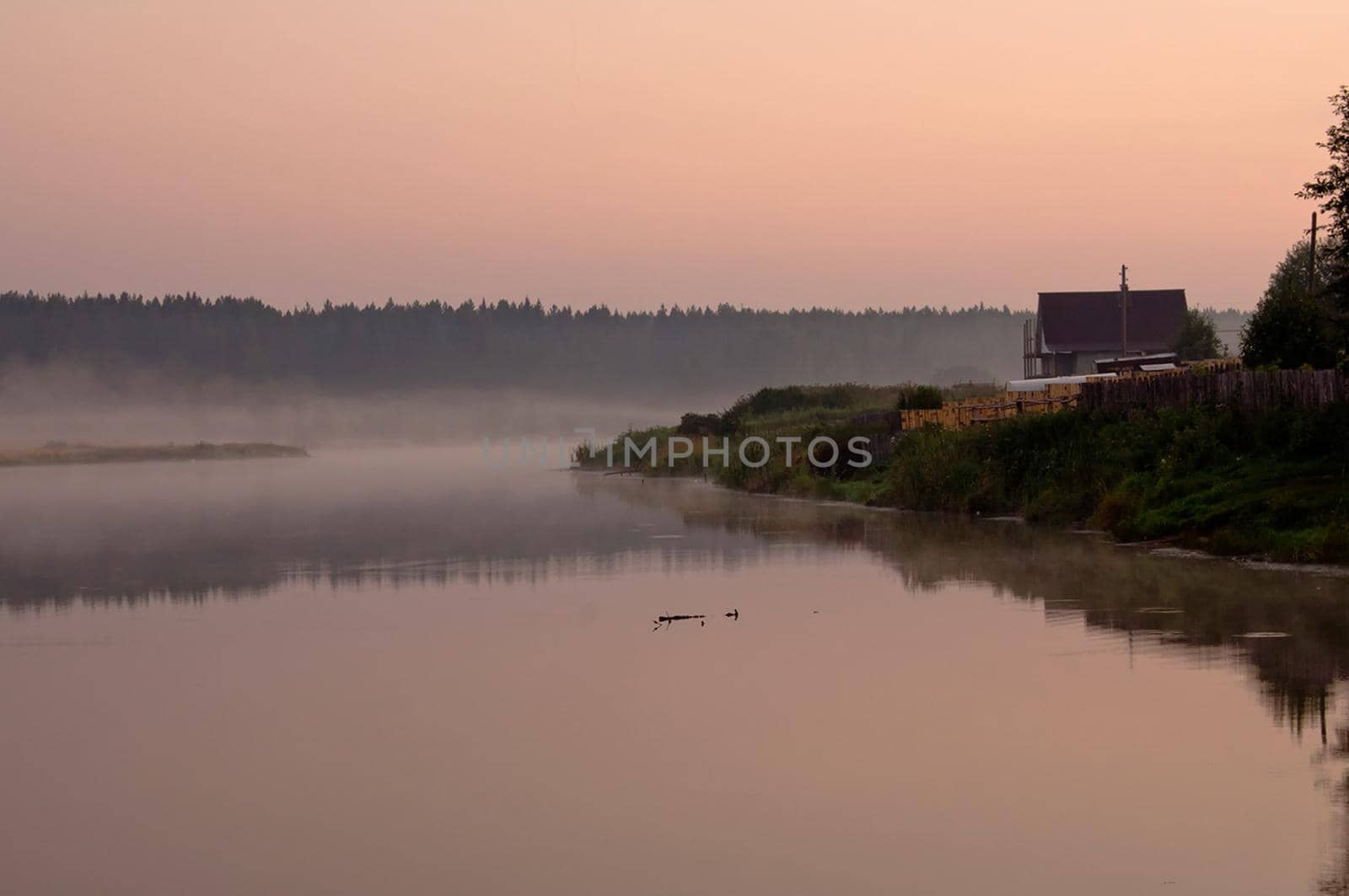 Smoke of mist over the pond. morning mist over the pond.