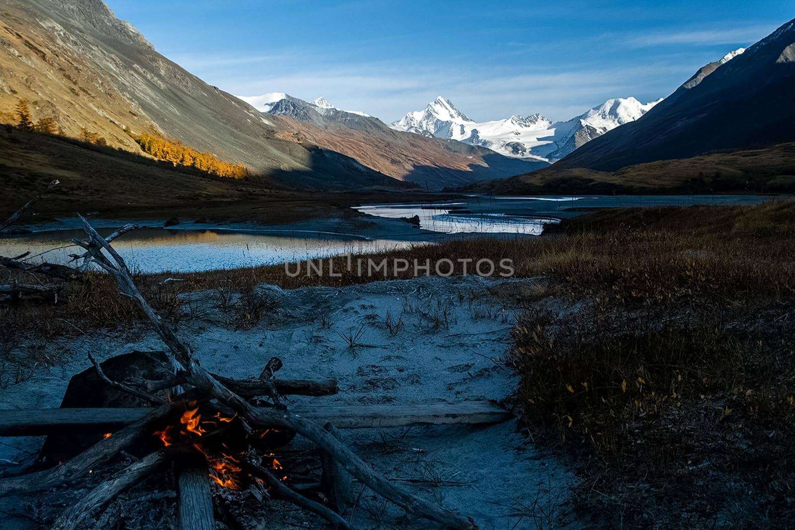 A bonfire on the banks of the Altai Mountain River.