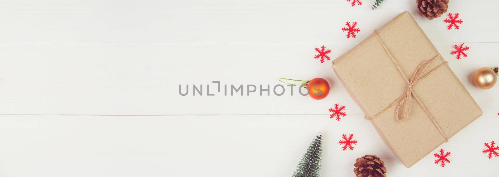 Christmas holiday composition with gift box decoration on wooden background, new year and xmas or anniversary with presents on wood table in season, top view or flat lay, copy space, banner website.
